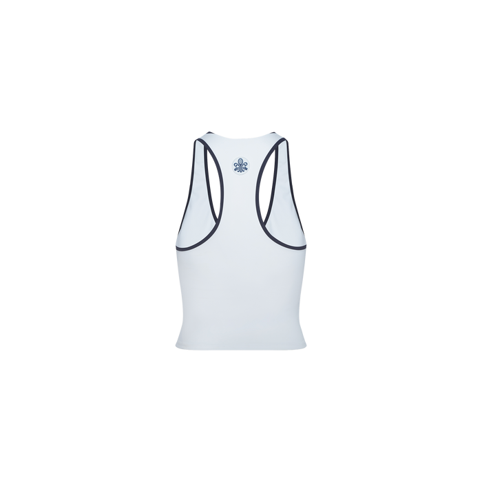 The Martina Racerback Tennis Tank is displayed from the back in light blue, with dark blue trim outlining the armholes and neckline, and a small blue floral emblem positioned near the upper center. The background is plain white.