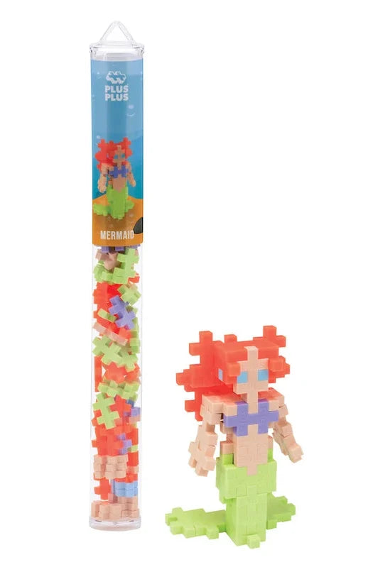 Mermaid figurine with building block packaging on a white background