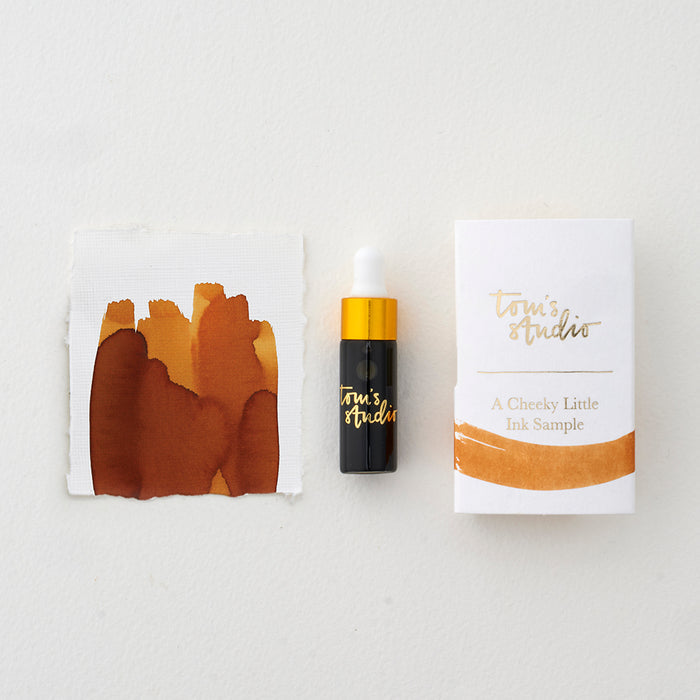 Tom's Studio Sepia Mini Fountain Pen Ink – featuring the packaging, bottle with pipette in lid and swatch