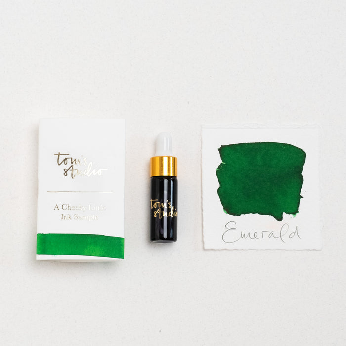 Tom's Studio Emerald Mini Fountain Pen Ink – featuring the packaging, bottle with pipette in lid and swatch