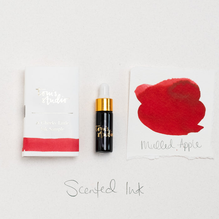Tom's Studio Mulled Apple Spice Scented Mini Fountain Pen Ink – featuring the packaging, bottle with pipette in lid and swatch