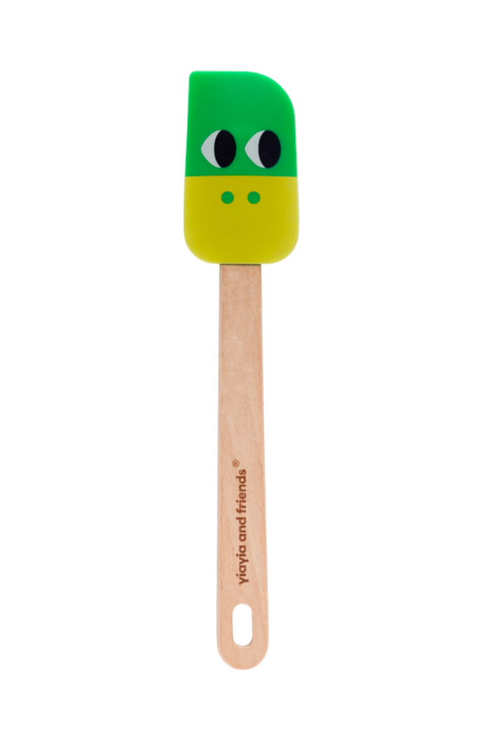 Green spatula with a wooden handle on a white background