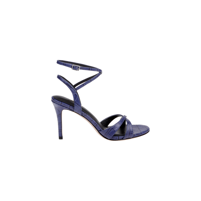 The Miranda Leather Sandal is a single high-heeled shoe in textured navy leather, featuring a thin ankle-wrap strap with buckle and crisscross straps over the open toe, displayed against a white background.
