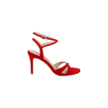 Introducing the Miranda Suede Sandal in a striking red hue, featuring a pointed high heel, two delicate straps over the toes, and an ankle-wrap strap secured with a petite buckle. Showcased on a white background, these sandals are perfect as elegant evening shoes.