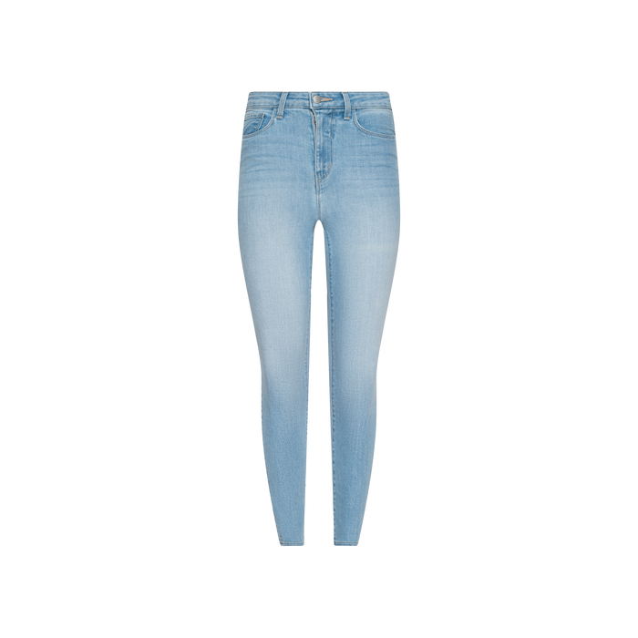 Monique Skinny Jean in light blue, crafted from stretch denim with a high-rise skinny fit, features front and back pockets along with a button and zipper closure, shown against a plain white background.