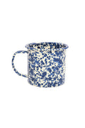 Blue and white speckled mug on a white background