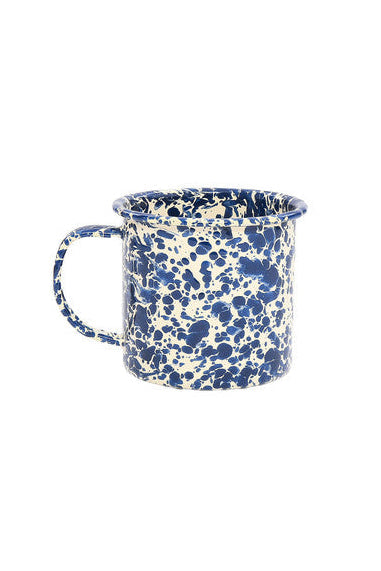 Blue and white speckled mug on a white background