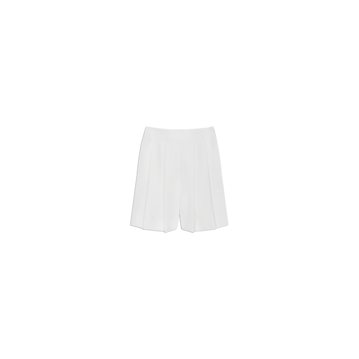 Naamah Pleated Short in white, featuring a tailored fit and fluid, wrinkle-resistant suit fabric—perfect for elevating your resort wardrobe. Shown against a plain white background.