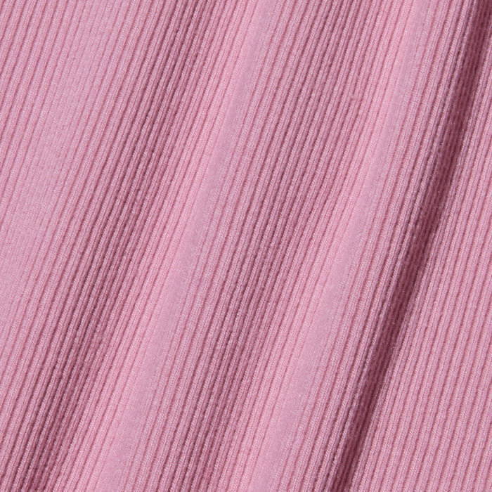 Close-up of the Nica Scoopneck Bodysuit’s pink stretch rib fabric, featuring diagonal and vertical textured lines for a subtle patterned effect.