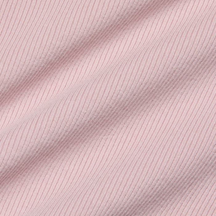 Close-up of the Nica Scoopneck Bodysuit in light pink, featuring high-stretch rib fabric with soft shadows emphasizing its texture and gentle folds.