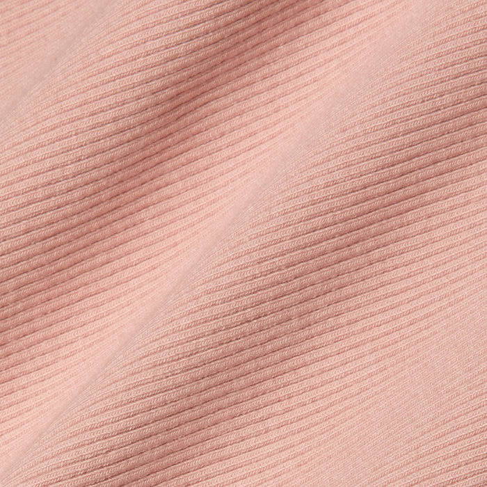 Close-up of light pink, high-stretch rib fabric with diagonal textured lines that form a raised and flat pattern across the material—an ideal choice for the Nica Scoopneck Bodysuit.