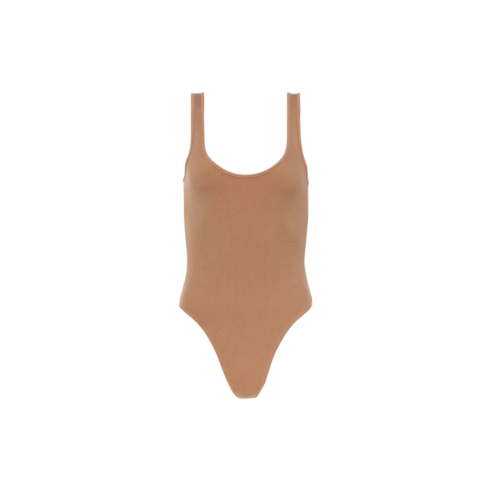 The Nica Scoopneck Bodysuit features a tan stretch rib fabric, sleeveless design, scoop neckline, and high-cut legs. Shown against a plain white background, it’s perfect as a versatile base layer.