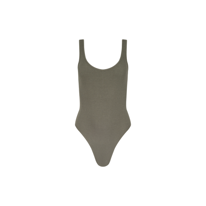 The Nica Scoopneck Bodysuit in smoky olive green features ribbed fabric, a sculpted fit, high-cut legs, and a scoop neckline, shown against a plain white background.