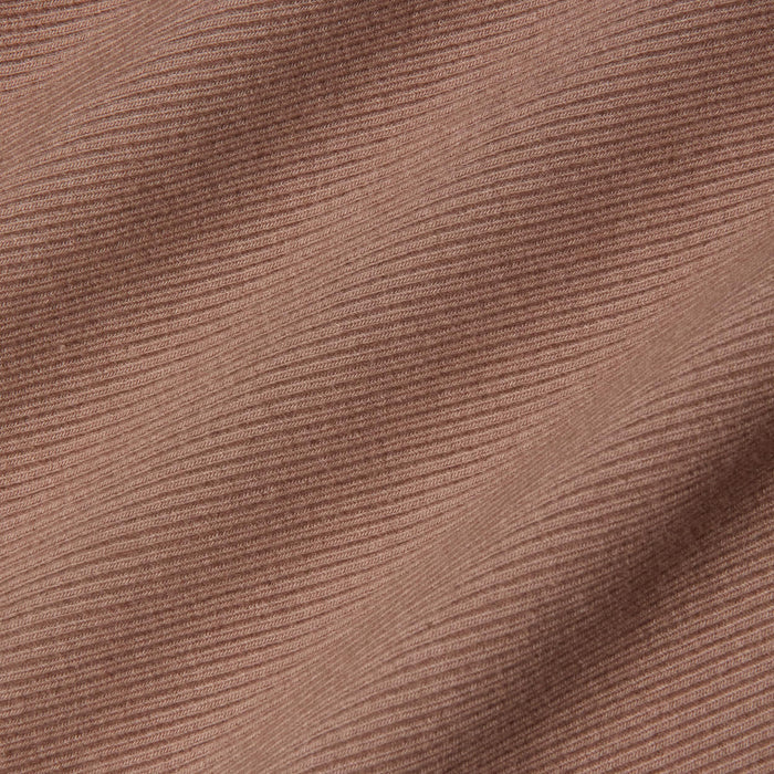 Close-up of the Nica Scoopneck Bodysuit in a brown, high recovery stretch rib fabric featuring horizontal textured lines and soft shadows that enhance its depth and dimension.