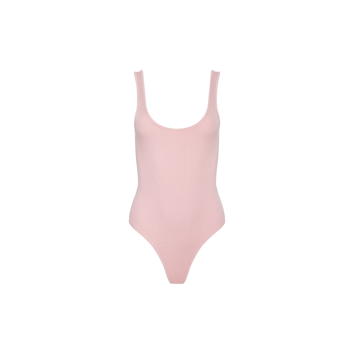 The Nica Scoopneck Bodysuit is a light pink, sleeveless bodysuit crafted from high-stretch rib knit. It features a scoop neckline and high-cut leg openings, and is shown on a plain white background. Perfect as a comfortable and stylish base layer.