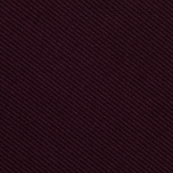 Close-up of the Nica Scoopneck Bodysuit’s textured fabric, showcasing diagonal ribbed lines in a deep burgundy hue and featuring high recovery stretch—perfect for a base layer.