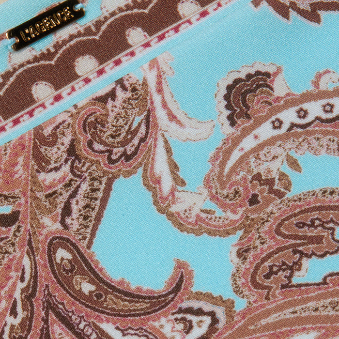 Close-up of the Nicole Bikini Bottom, featuring a brown and pink paisley print on a light blue stretch nylon fabric; a small LAUREN metal tag is visible at the top left.