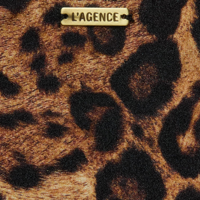 Close-up of the Nicole Bikini Bottom in leopard print, featuring moderate coverage and a small metallic LAGENCE label attached near the top center.