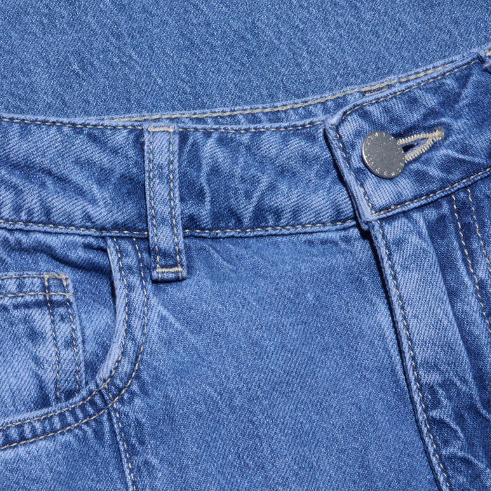 Close-up of the waistband and front pocket of the Niles Wide-Leg Jean in blue lightweight denim, featuring a metal button, belt loop, and detailed stitching on the fabric.
