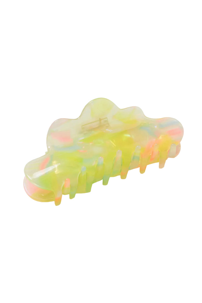 Neon green and pink hair clip on a white background