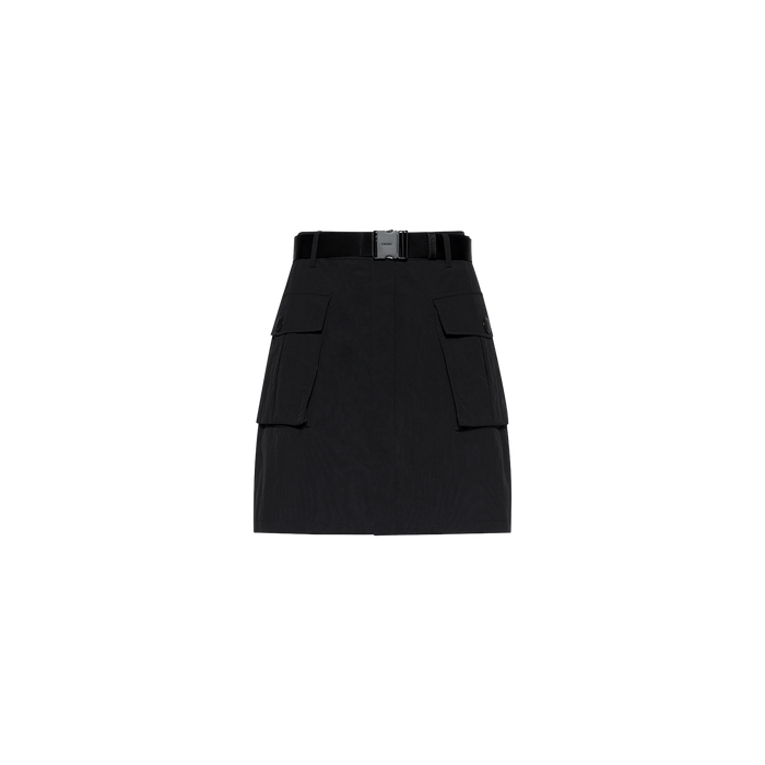 The Norene Nylon Mini Skirt, crafted from water-repellent nylon in black, features large front cargo pockets and a wide belt with a rectangular buckle, displayed on a plain white background.