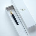 The One-Dip-Nib in Brass, shown in packaging