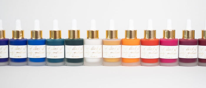 A selection of Tom's Studio Calligraphy ink's in frosted glass bottles with pipettes