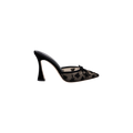 Prasad Mesh Mule featuring black mesh with a high sculpted heel, pointed toe, delicate bow detail, and butterfly embroidery. Shown in a side view on a white background.