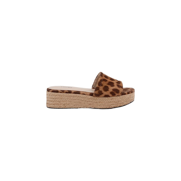 The Ramani Platform Espadrille is a single flat platform slide sandal featuring a brown and black leopard print suede strap and a braided jute sole, shown from the side on a white background—perfect for effortless summer style.