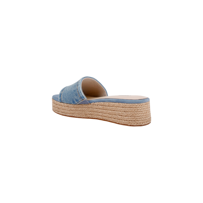 The Ramani Platform Espadrille features a denim upper, open toe, and woven platform espadrille sole. Shown from the back left against a white background, it’s perfect for warm-weather style.