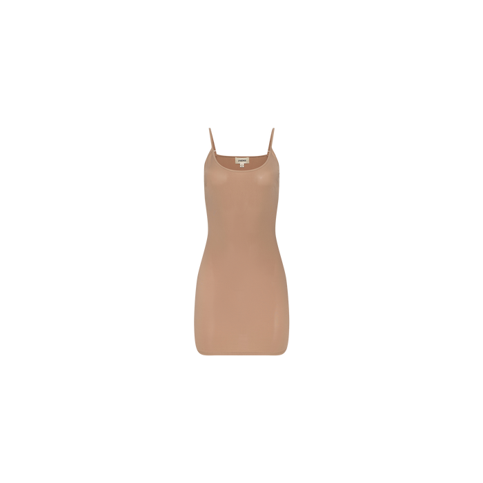 The Raye Slip Lining Dress is a nude-colored, sleeveless design made from stretch jersey, featuring thin adjustable straps and shown against a plain white background.