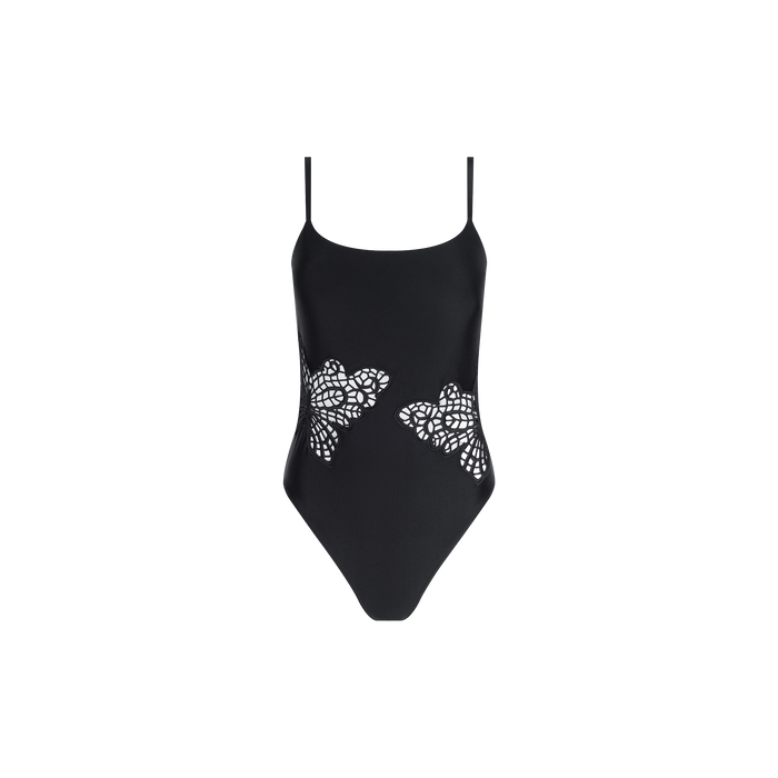 Remi One-Piece Swimsuit in black, featuring thin straps and intricate floral cutout designs along both sides of the waist for a glamorous poolside look, showcased against a plain white background.