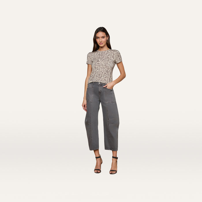 Woman wearing the Ressi Fitted Tee in gray leopard print, paired with gray cropped pants and black high-heeled sandals, standing against a plain white background.