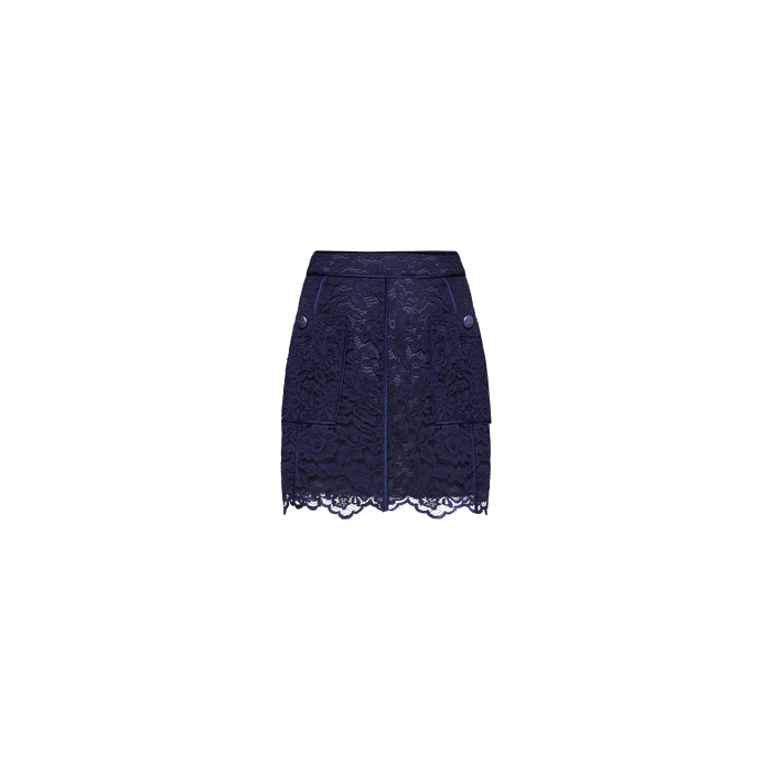 The Riven Lace Mini Skirt in midnight blue showcases a flattering A-line mini silhouette with delicate floral lace, front pockets, button details, and a scalloped hem, displayed on a plain white background.