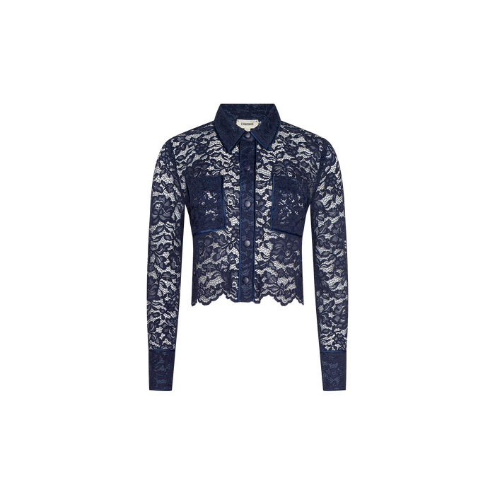 The Roelle Lace Blouse is a sheer navy lace blouse with long sleeves, a collar, two front chest pockets, and a button-down front with scalloped edges, displayed on a white background.