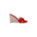 The Rosaline Wedge Espadrille is a red suede open-toe sandal featuring a woven beige espadrille wedge heel and crisscross straps, shown against a plain white background.