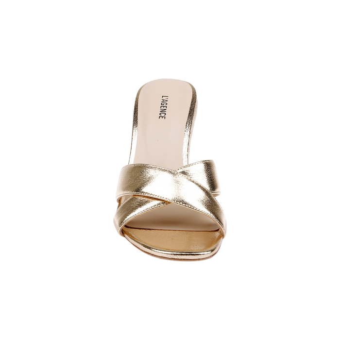 A gold leather, open-toe heeled sandal called the Rosaline Wedge Espadrille, featuring crisscross straps and “LAURENCE” printed on the memory foam insole, photographed on a white background.