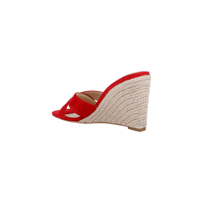 The Rosaline Wedge Espadrille, showcased from the side against a plain white background, features crisscross red suede straps and an espadrille-style woven platform wedge heel, complete with a comfortable memory foam insole.
