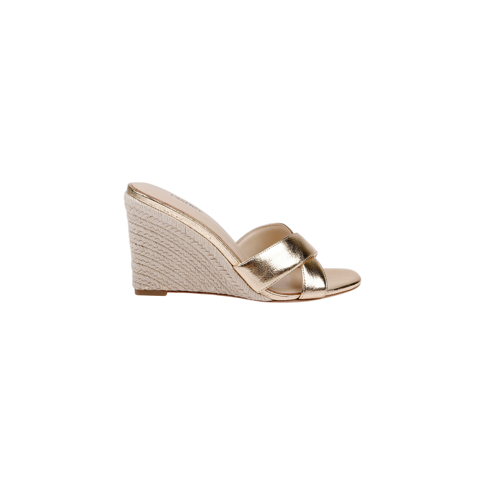 The Rosaline Wedge Espadrille is a gold leather wedge sandal with two wide metallic straps and an espadrille-style woven heel, featuring a memory foam insole for added comfort, shown in profile on a white background.