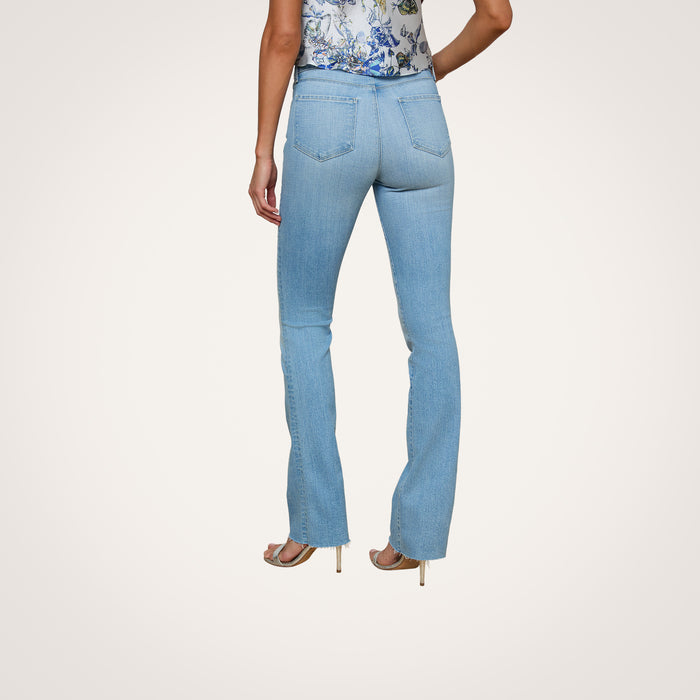 A person wearing the Ruth Straight-Leg Jean, a floral sleeveless top, and heeled sandals is shown from the back against a plain white background.