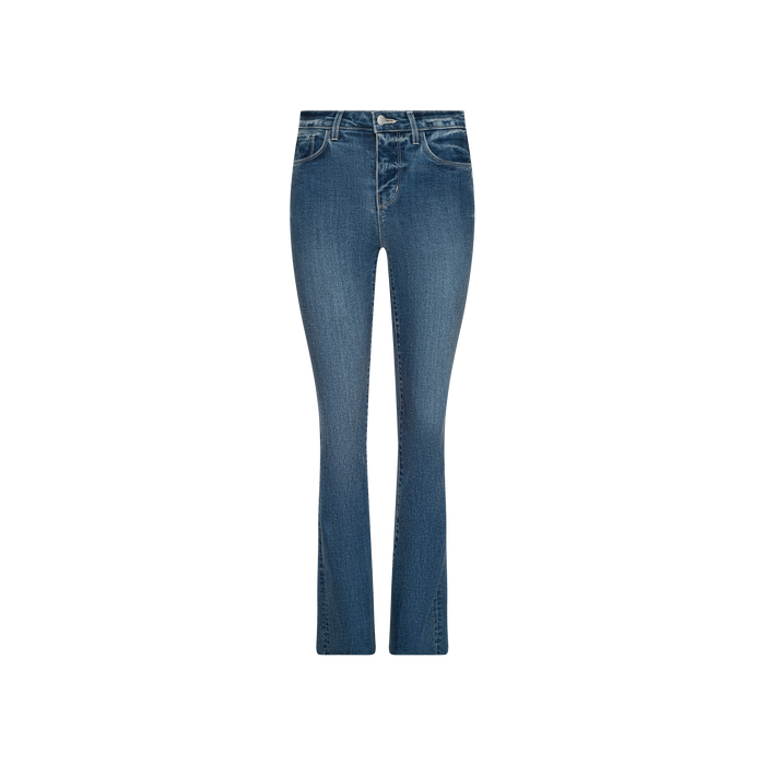 The Ruth Straight-Leg Jean, featuring indigo denim with a subtle flare at the hem, five-pocket styling, raw-edge detailing, and visible stitching, is displayed on a plain white background.