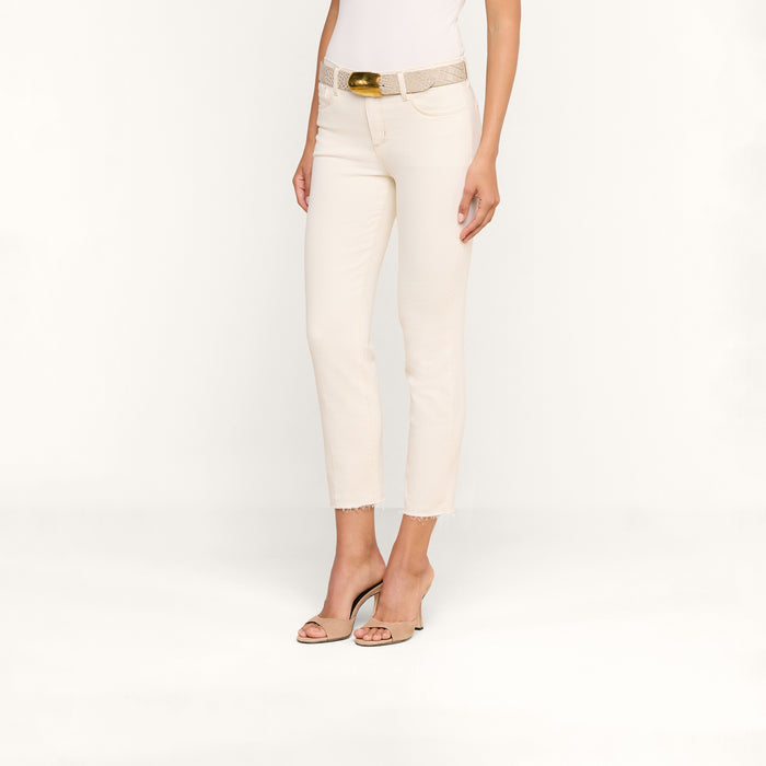 A woman models the Sada Slim-Leg Cropped Jean with a belt and heeled sandals against a plain white background. Her face is not visible.
