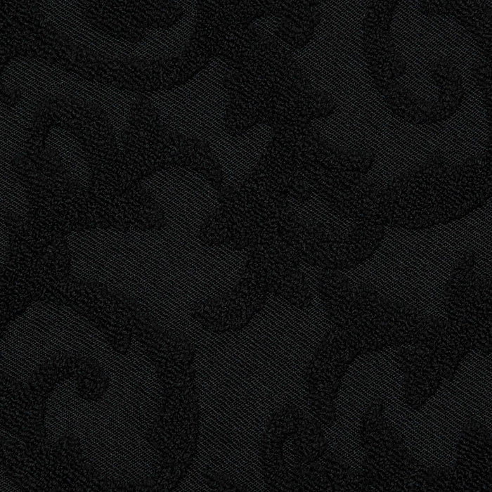 The Sally Bandeau Top features black jacquard terry fabric with a subtle, raised swirling floral pattern. Its textured design produces a tone-on-tone effect, giving the top an elegant and richly detailed look while maintaining a monochromatic black color scheme infused with retro glamour.