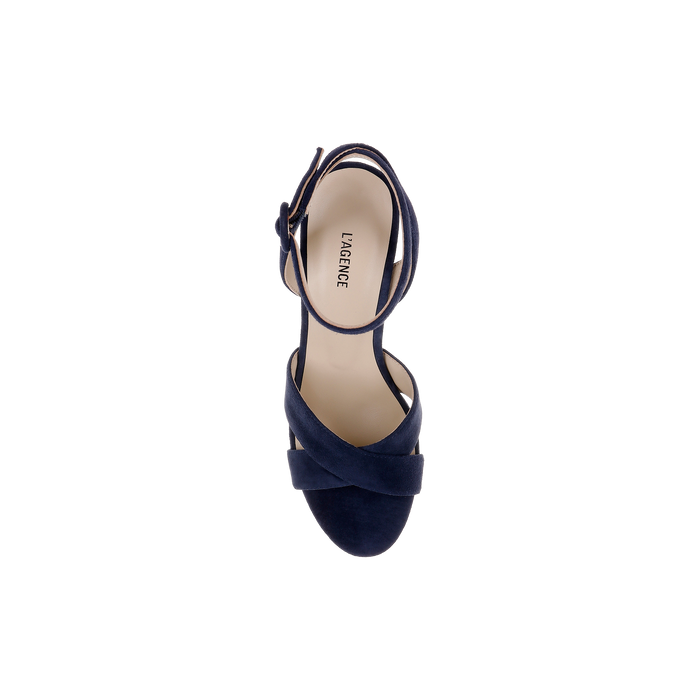 Top view of a single Sandrine Platform Sandal in navy blue, featuring crisscross straps and an ankle strap, displayed on a plain white background. The insole displays the LAGENCE logo printed in black.