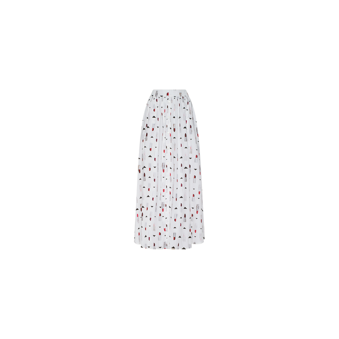 The Seina Poplin Midi Skirt is a white, knee-length design with a gathered waist and features a playful pattern of small black and red geometric shapes scattered evenly across the fabric.