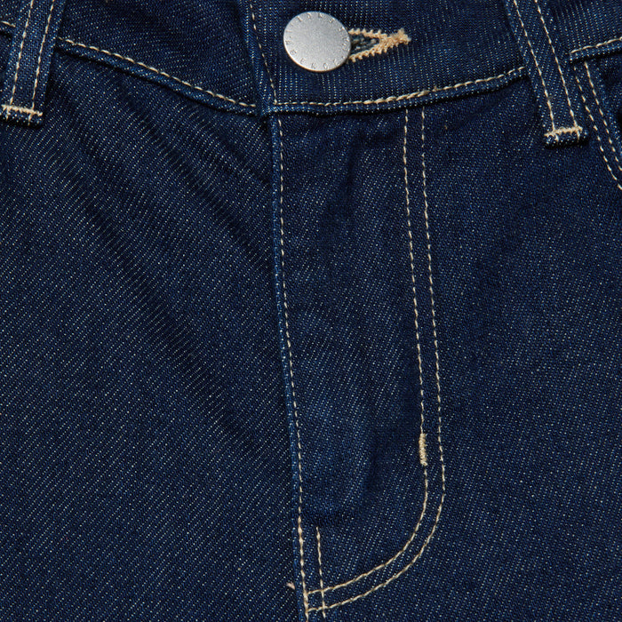 Close-up of the front of the Selma Bootcut Jean in blue stretch denim, highlighting the zipper area, metal button, visible stitching, and belt loops.