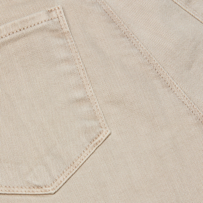 Close-up of the Selma Bootcut Jean in beige stretch denim, featuring visible stitching and a partial view of the left-side pocket.