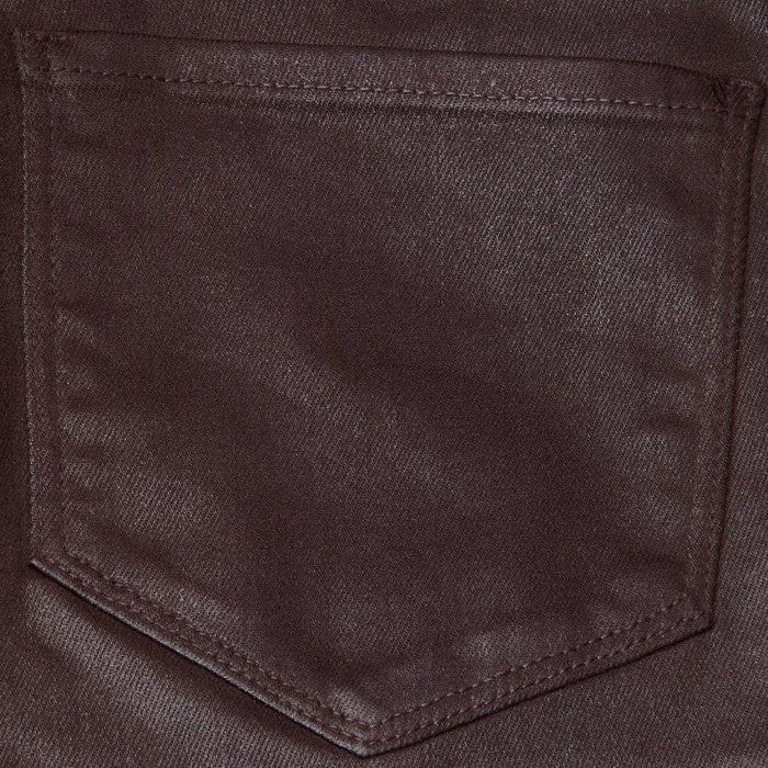 Close-up of the Selma Coated Bootcut Jean in chocolate brown denim, highlighting a stitched pocket with a pointed bottom and visible seam detailing along the edges.