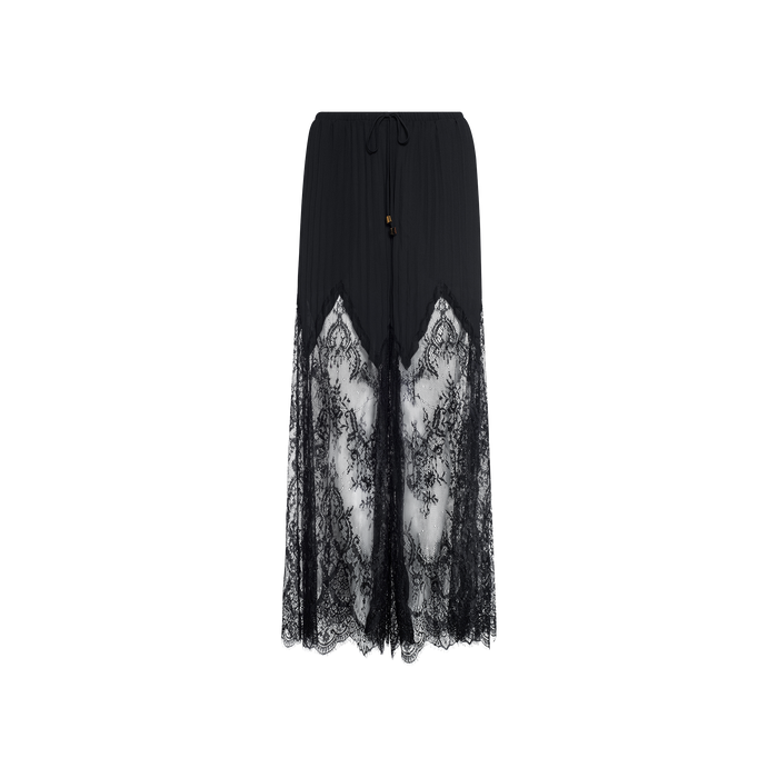 A Sharon Cover-Up Pant in black, featuring sheer lace panels and intricate floral lace detailing, designed with a drawstring waist and scalloped hem, displayed against a plain white background.