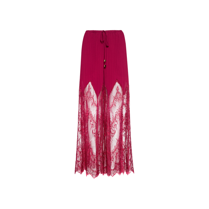 The Sharon Cover-Up Pant is a long, deep pink skirt featuring pleated chiffon at the top, sheer lace panels extending from mid-thigh to hem, a tie waist, and two decorative beads. It is displayed against a plain white background.